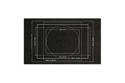 Black puzzle mat with white printed guides for positioning puzzles of
different dimensions.